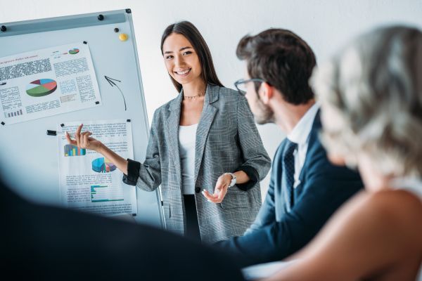 Woman presenting to her team