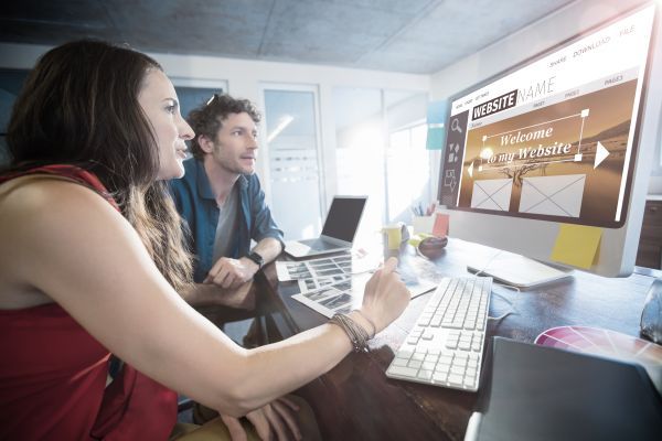 A man and a Woman building a website together