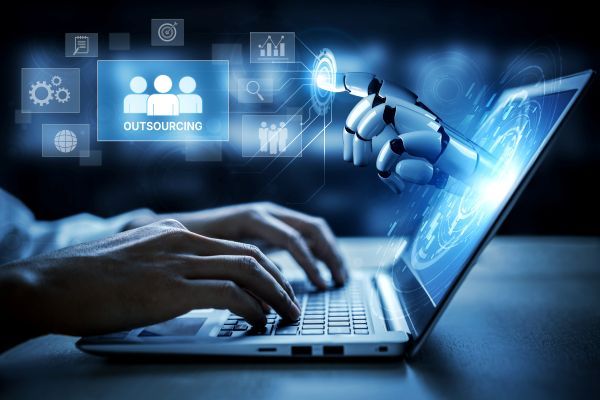 Humans and AI collaborating on work on a laptop