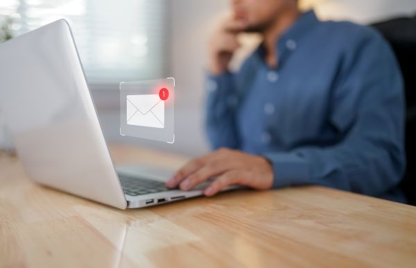 Man getting an email notification on his laptop